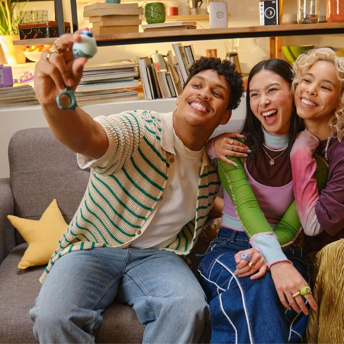 Friend group taking selfie using the Instax Pal Digital camera